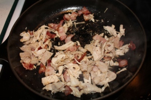 Add in about a cup of cooked chicken, cut into small pieces (although mine appears to have been shredded by a wild animal.)