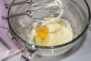 Start by mixing together the flour and baking powder in a separate bowl. Set aside. Cream butter then add egg and whip until light. Add sugar and mix well.
